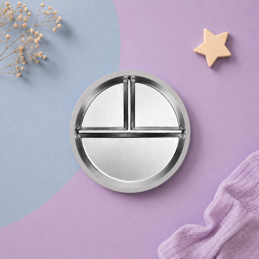 Round metal tray with compartments on a soft Grey background