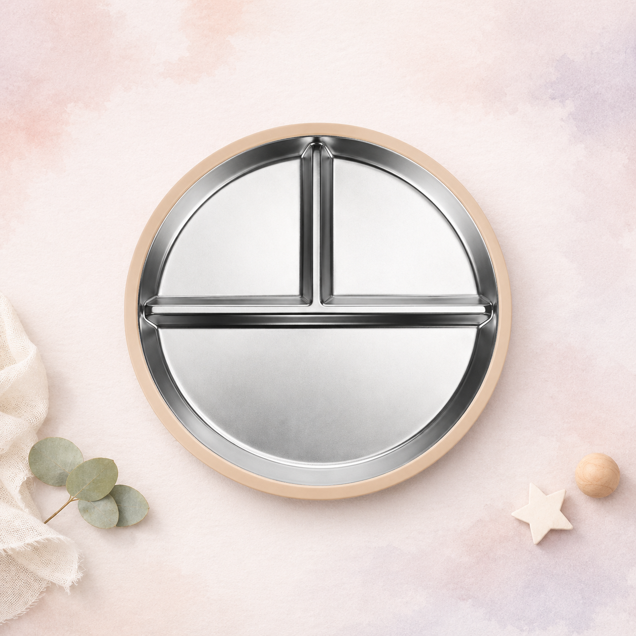 Round mirror with a metallic frame on a soft pink background