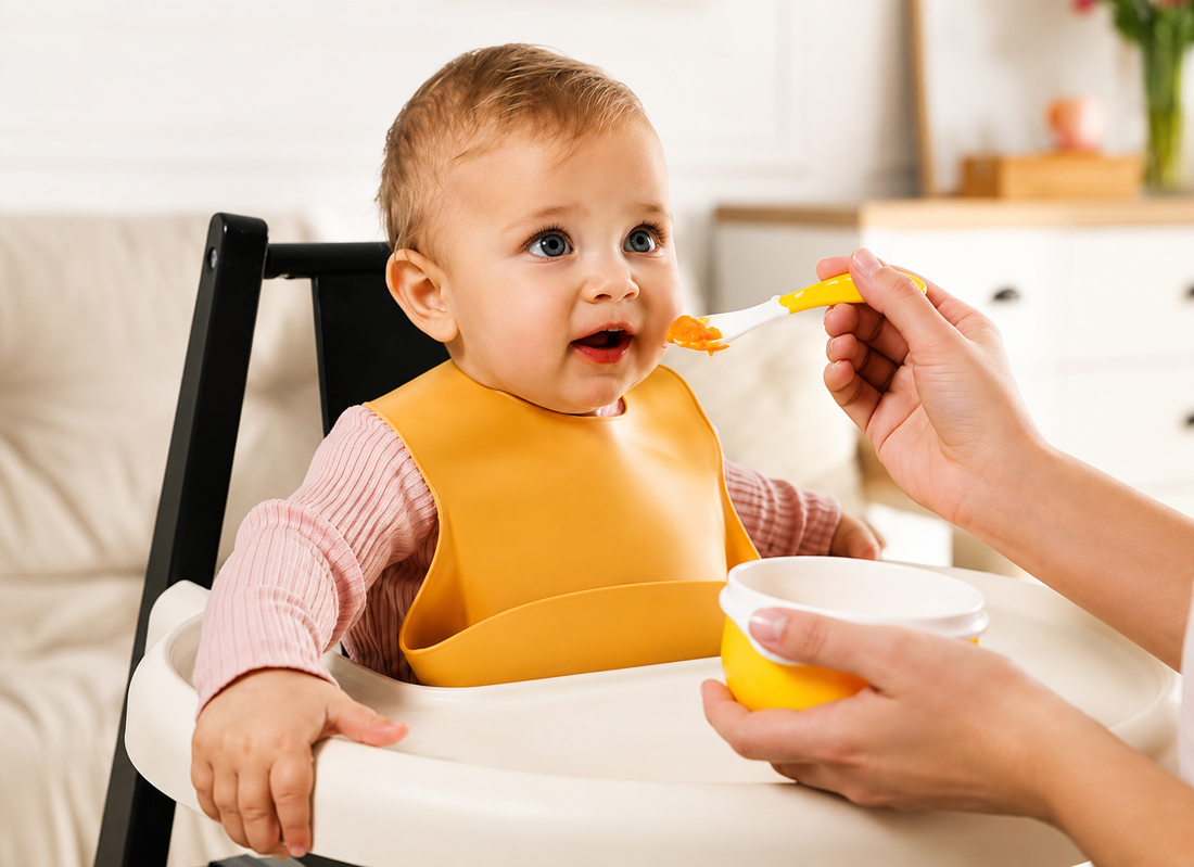 Baby with yellow bib