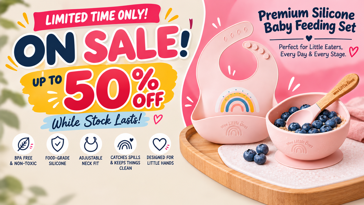 Pink silicone baby feeding set including a bib, bowl, and spoon on a wooden tray, with promotional text offering up to 50% off.