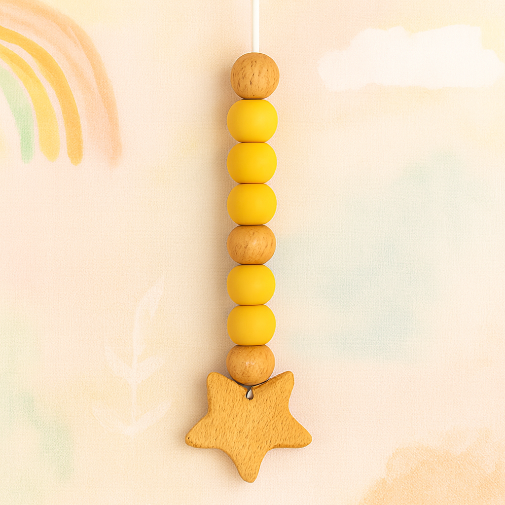 Yellow bead pacifier clip with wooden star and round wooden beads on string.