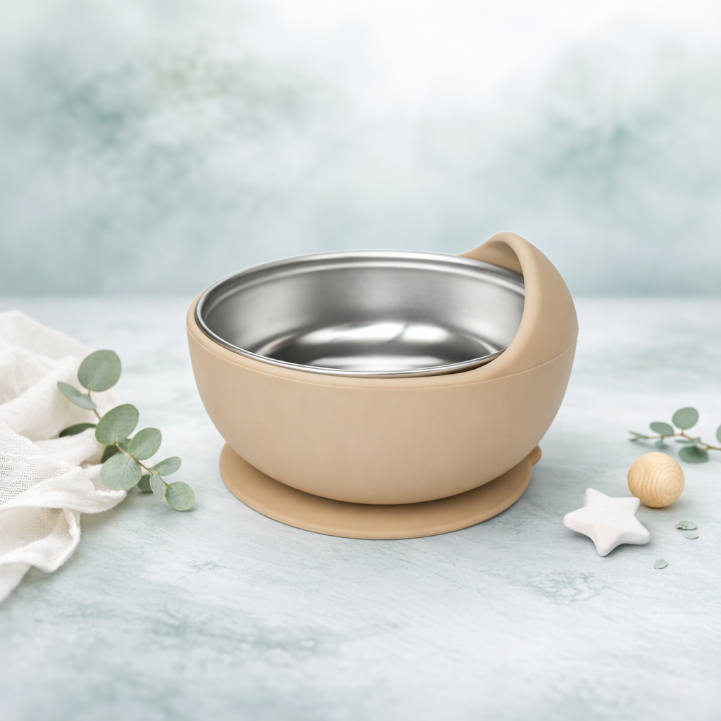 Beige bowl with a metal interior on a light blue background