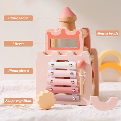 Pink and natural wood wooden princess castle toy with mirror, piano pieces, abacus beads, and shape sorter.