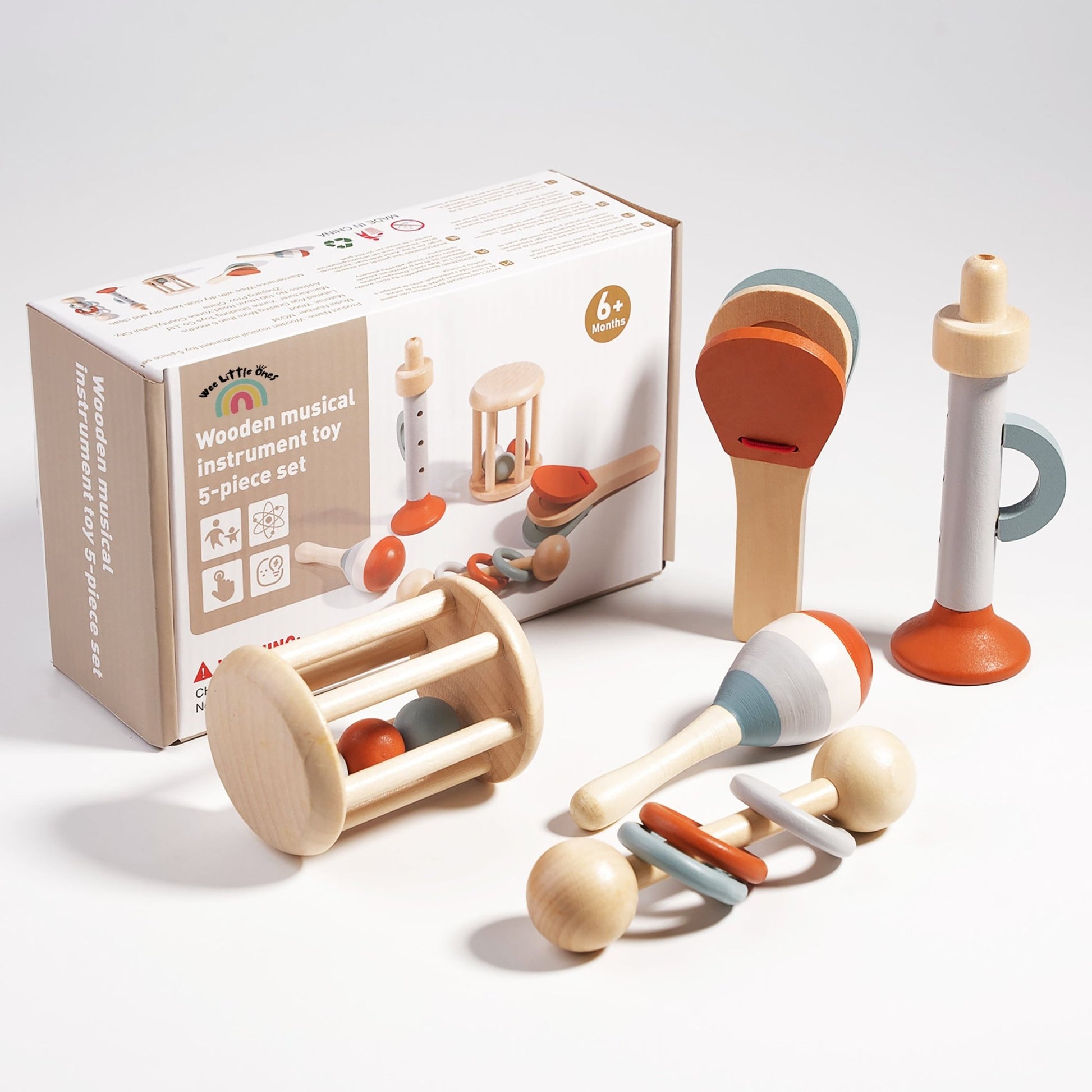 Wooden baby musical toy set with drum, maracas, rattle, and shaker in soft pastel colors.