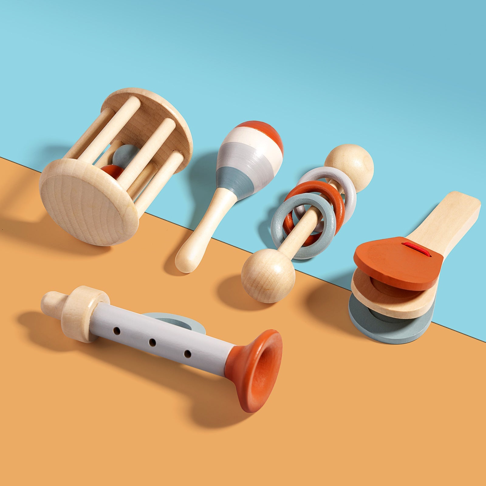 Wooden baby musical toy set with rattle, maracas, recorder, casting shaker, and rolling drum in natural and orange tones.